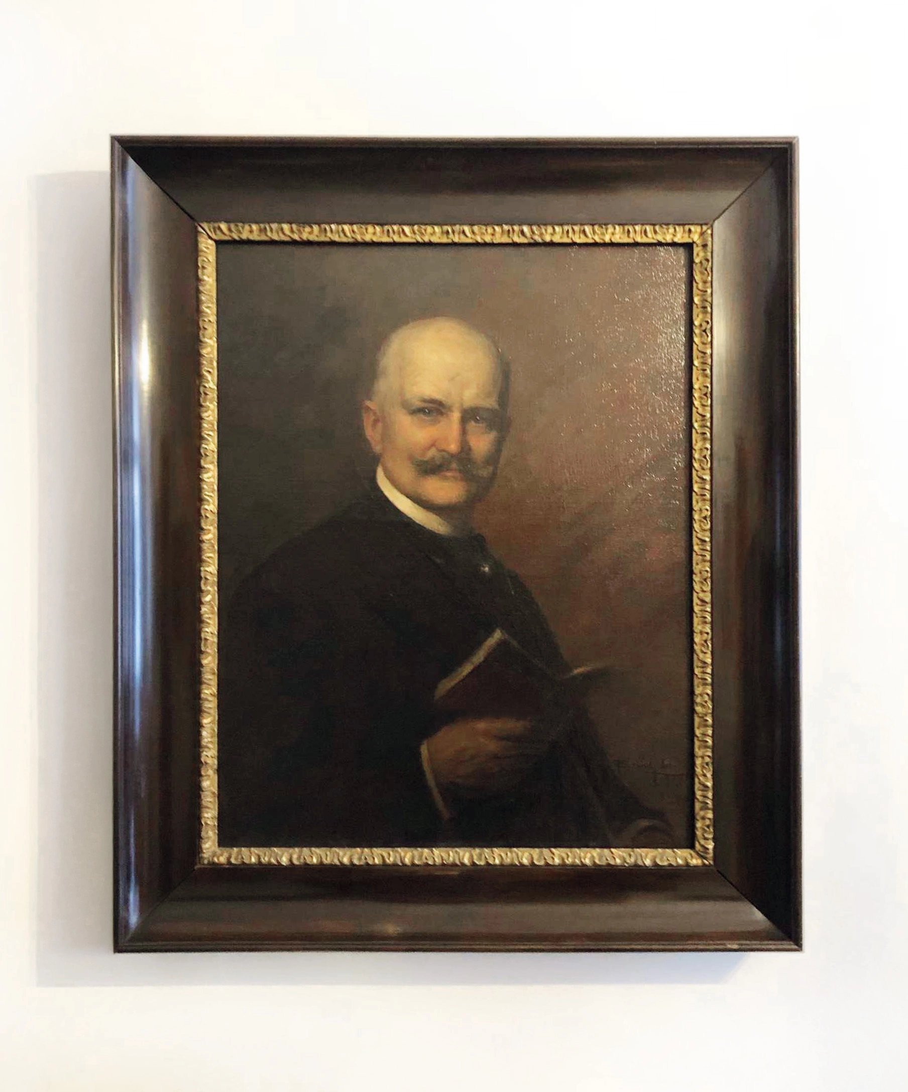 Kanzlei WIRE – Foto Reich-Rohrwig, Großvater-Porträt an der Wand Historisches Porträt von Reich-Rohrwig, dem Großvater der traditionsreichen Anwaltskanzlei WIRE.